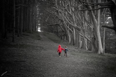 Running Children in Dark Forest near Moss Landing